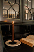 The Candlestick Holder